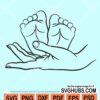 Female hands with baby feet svg