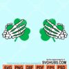 Skeleton hands with clover svg
